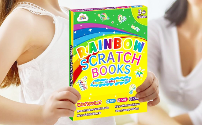 A Kid Holding a Rainbow Scratch Notebook