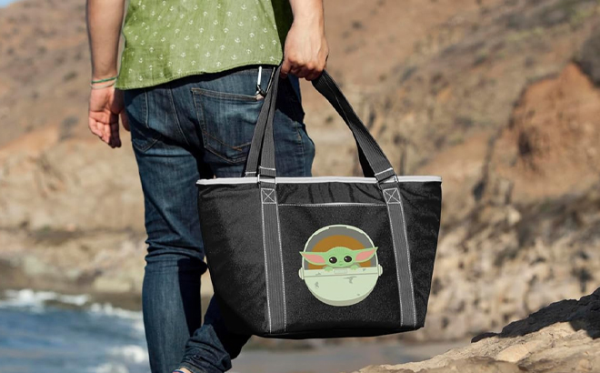 A Man Holding Picnic Time Star Wars Tote Cooler Bag