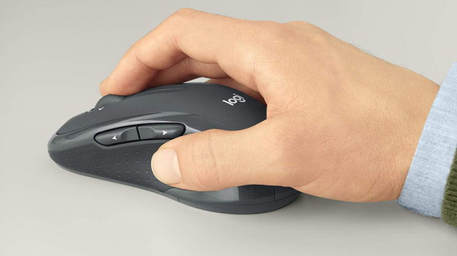 A Man Using the Logitech Wireless Computer Mouse