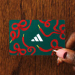 A Person Holding Adidas Gift Card