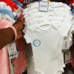 A Person Holding Carters Just One You Baby 4 Pack Short Sleeve Bodysuits