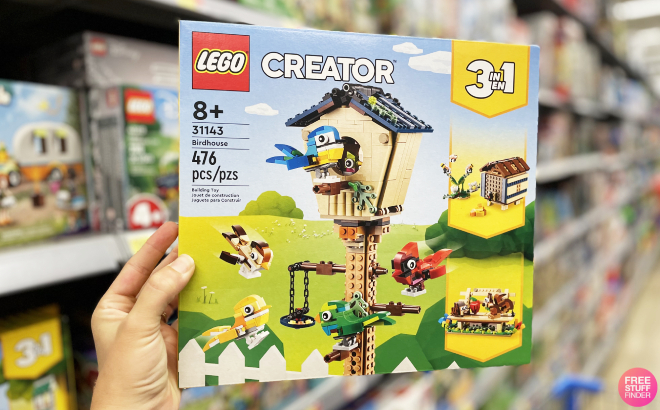 A Person Holding LEGO Creator 3 in 1 Birdhouse Birds to Hedgehog to Beehive Set