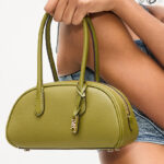 A Person Holding Michael Kors Lulu Small Pebbled Leather Satchel in Smokey Olive Color