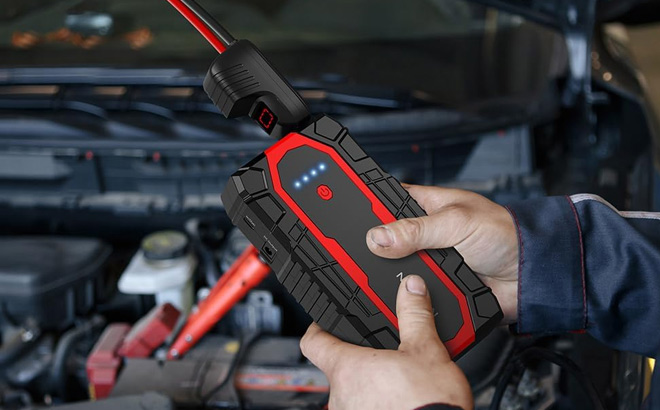 A Person Holding Nusican Car Jump Starter