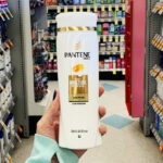 A Person Holding Pantene Daily Moisture Renewal 72 Hour Lush Moisture Shampoo