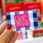 A Person Holding a Bath Body Works Gift Card