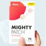 A Person Holding a Box of Hero Mighty Patch