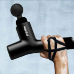 A Person Holding a FitRx Massage Gun