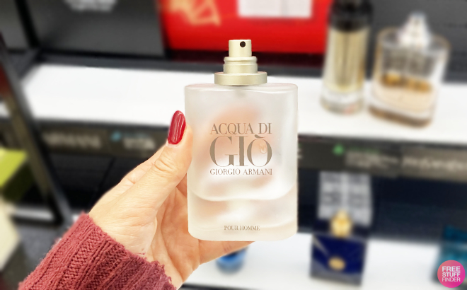 A Person Holding a Giorgio Armani Acqua Di Gio Perfume