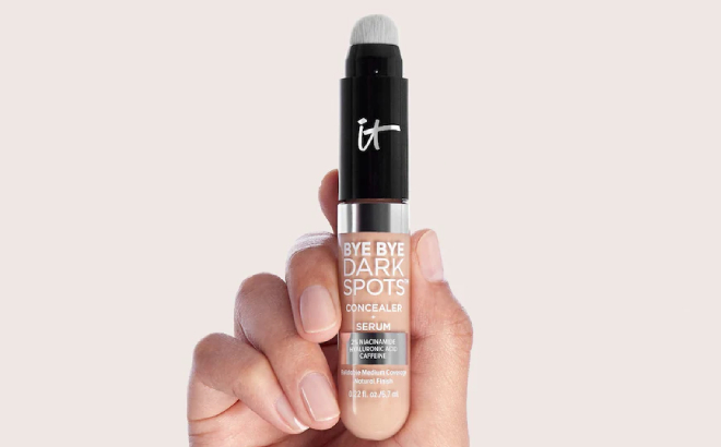 A Person Holding an IT Cosmetics Bye Bye Dark Spots Concealer Serum