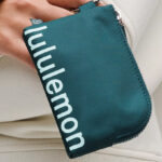 A Person Holding the Lululemon Clippable Card Pouch in Teal