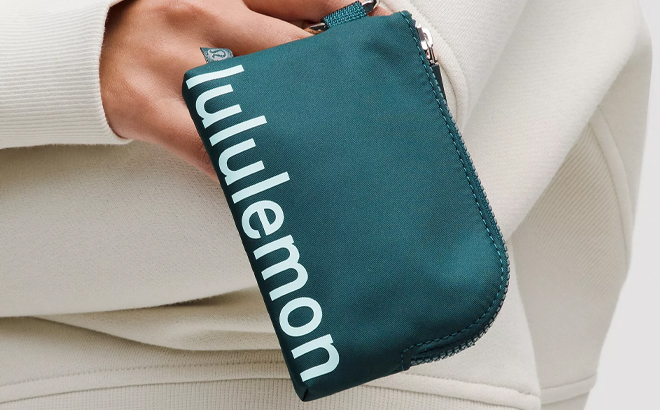 A Person Holding the Lululemon Clippable Card Pouch in Teal