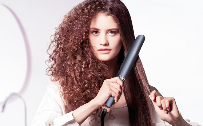 A Person Straightening her Hair Using Landot Hair Straightener Curler