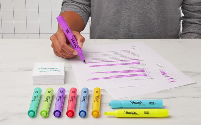 A Person Using Sharpie Highlighters