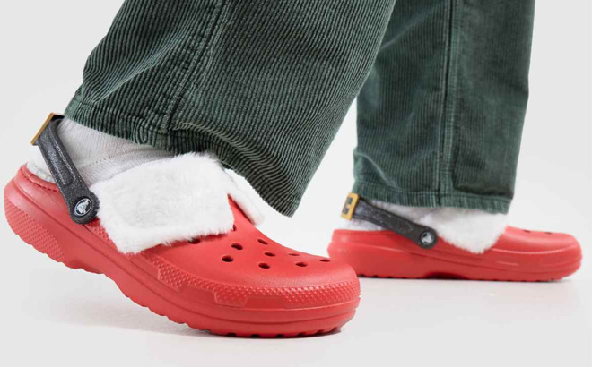 A Person Wearing Crocs Classic Lined Santa Clogs