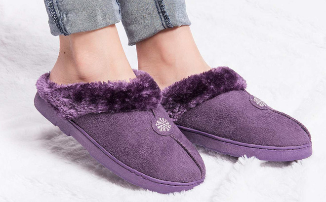 A Person Wearing Muk Luks Polysuede Womens Slippers