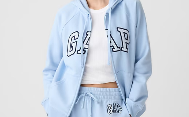 A Person Wearing the Gap Logo Zip Hoodie in Light Blue