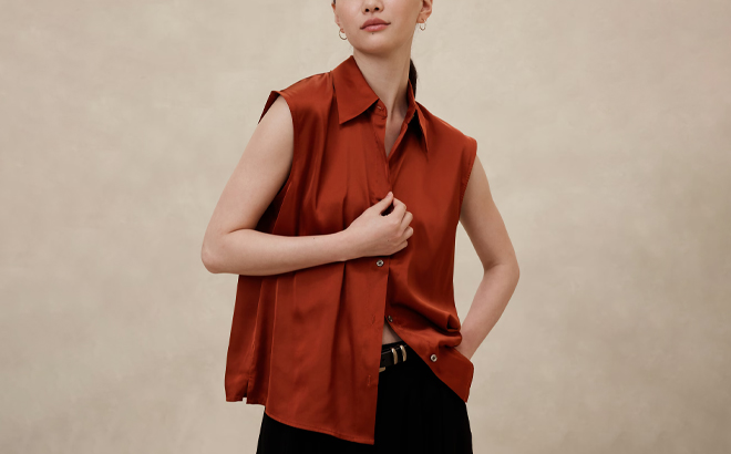 A Person wearing Banana Republic Collared Blouse in Tandoori Red Color