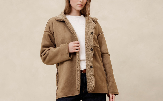 A Person wearing a Banana Republic Factory Reversible Sherpa Jacket