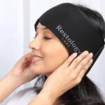 A Person wearing a Restology Labs Migraine Relief Cap