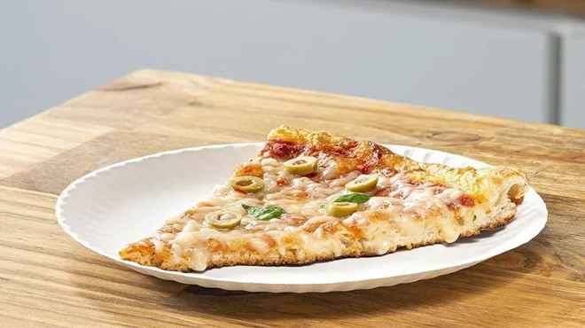 A Pizza Served on a Nicole Home Collection White Uncoated Small Paper Plate