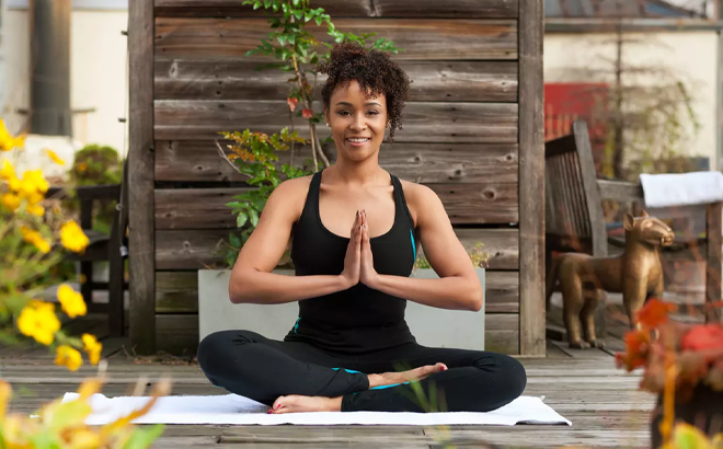 A Woman Doing Yoga on a Porch