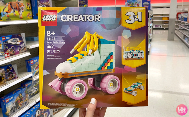 A Woman Holding LEGO Creator 3 in 1 342 Piece Retro Roller Skate Building Kit