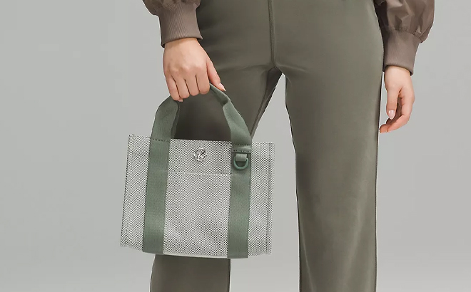 A Woman Holding Lululemon Two Tone Canvas Mini Tote Bag