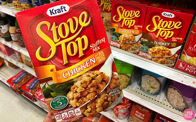 A Woman Holding Stove Top Stuffing Mix for Chicken