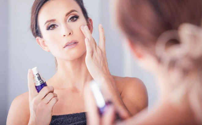 A Woman Using a BioTrust Ageless Glow Skin Serum to Rejuvenate Skin