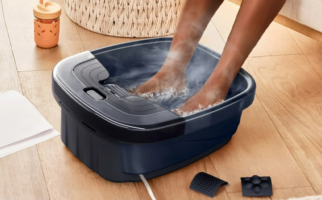 A Woman Using the Homedics Bubble Bliss Deluxe Foot Spa Massager