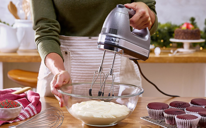 A Woman Using the KitchenAid 9 Speed Digital Hand Mixer