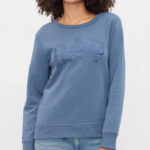 A Woman Wearing GAP Factory Relaxed Western Gap Logo Sweatshirt