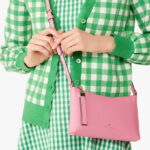 A Woman Wearing Kate Spade Outlet Sadie Small Crossbody