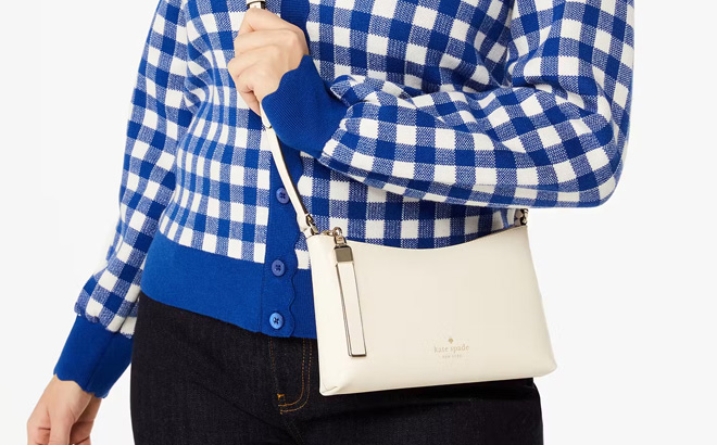 A Woman Wearing Kate Spade Outlet Sadie Small Crossbody Bag 1