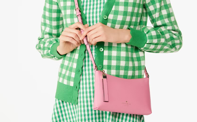 A Woman Wearing Kate Spade Outlet Sadie Small Crossbody