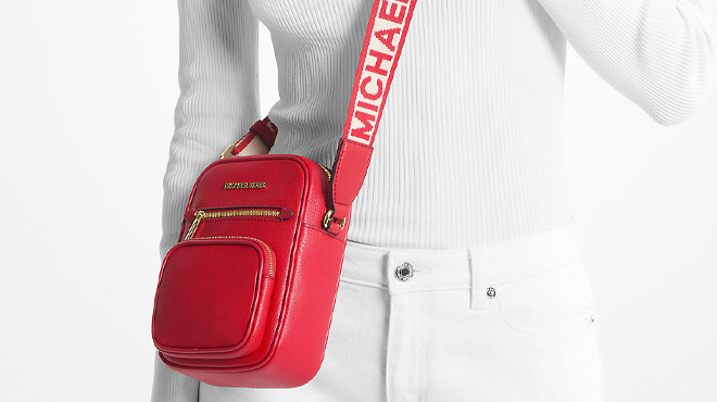 A Woman Wearing Michael Kors Jet Set Medium Leather Crossbody Bag