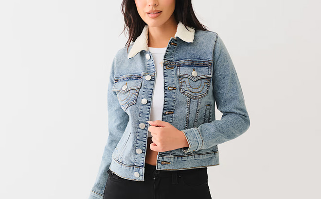 A Woman Wearing True Religion Sherpa Collar Trucker Denim Jacket