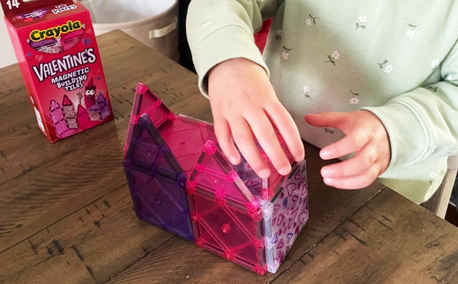 A child playing wiht CreateOn Crayola Valentines Magnetic Tile