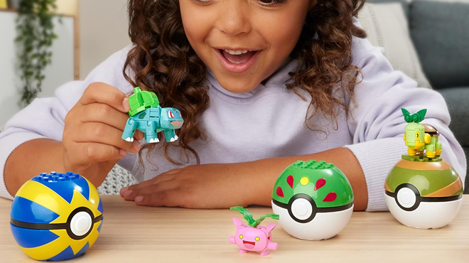 A child playing with Mega Pokemon Building Toys Set