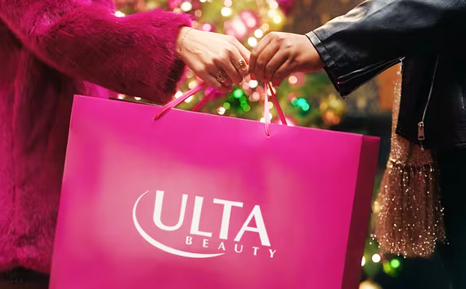 A couple holiding a Pink Ulta Beauty Shopping bag