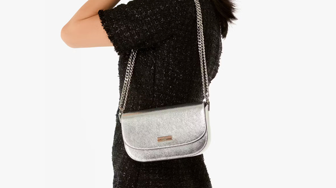 A lady bringing a Kate Spade Krista Metallic Crossbody