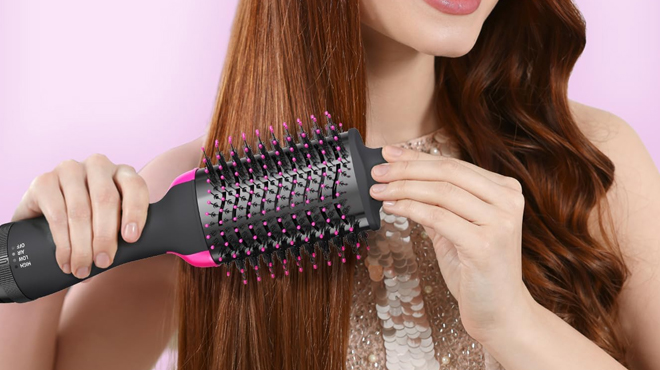 A lady fixing her hair using Focala Hot Air Brush