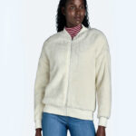 A lady wearing a Time and Tru Womens Fleece Bomber Jacket