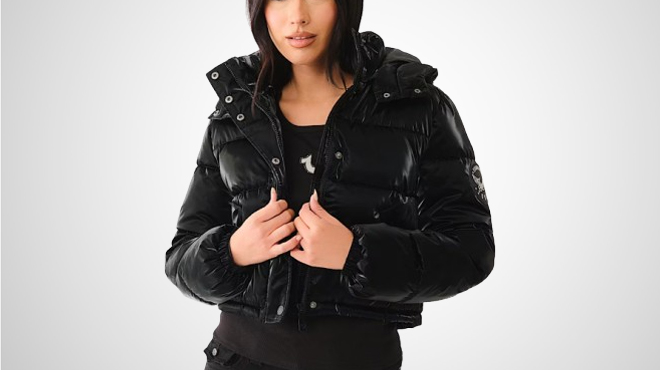 A lady wearing a True Religion Leather Hooded Puffer Jacket