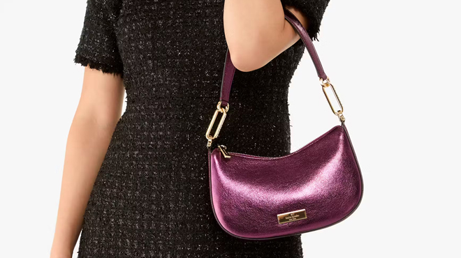 A lady with a Kate Spade Nina Metallic Shoulder Bag