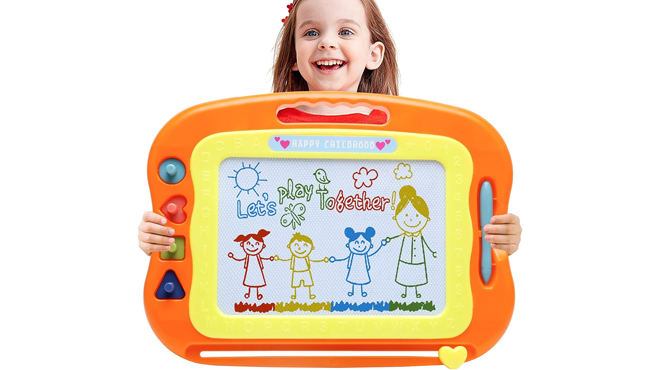 A little girl holding a Bablocvid Magnetic Drawing Board