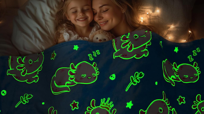 A mother and daughter sleeping covered in Hohoto Axolotl Blanket Glow in The Dark Kids Blanket