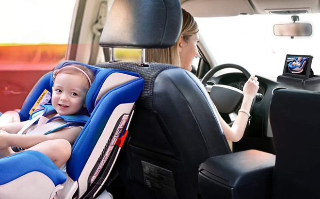 A mother driving and monitoring her child at the backseat using a Itomoro Baby Car Camera