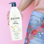 A person Holding a Jergens Skin Firming Body Lotion